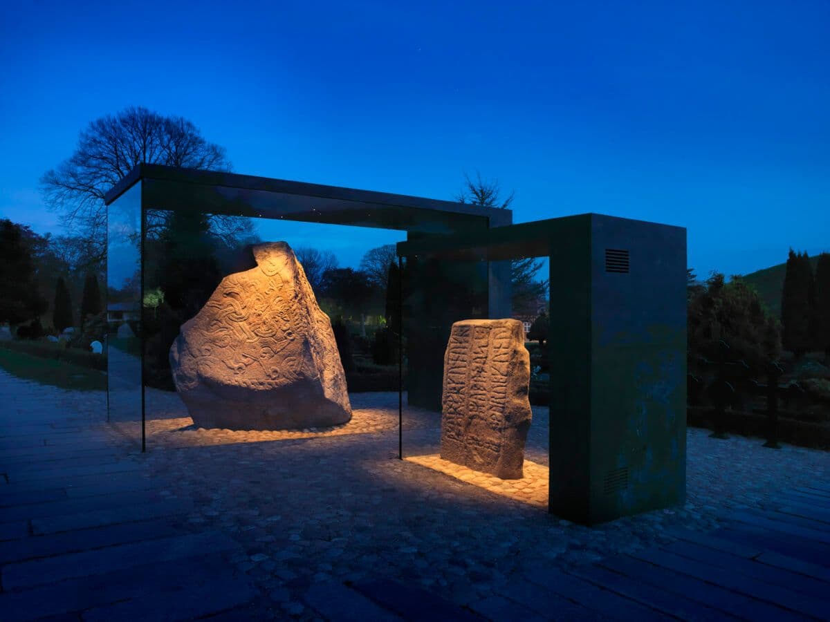 The Jelling stones illuminated inside their display cases at Jelling, Denmark.