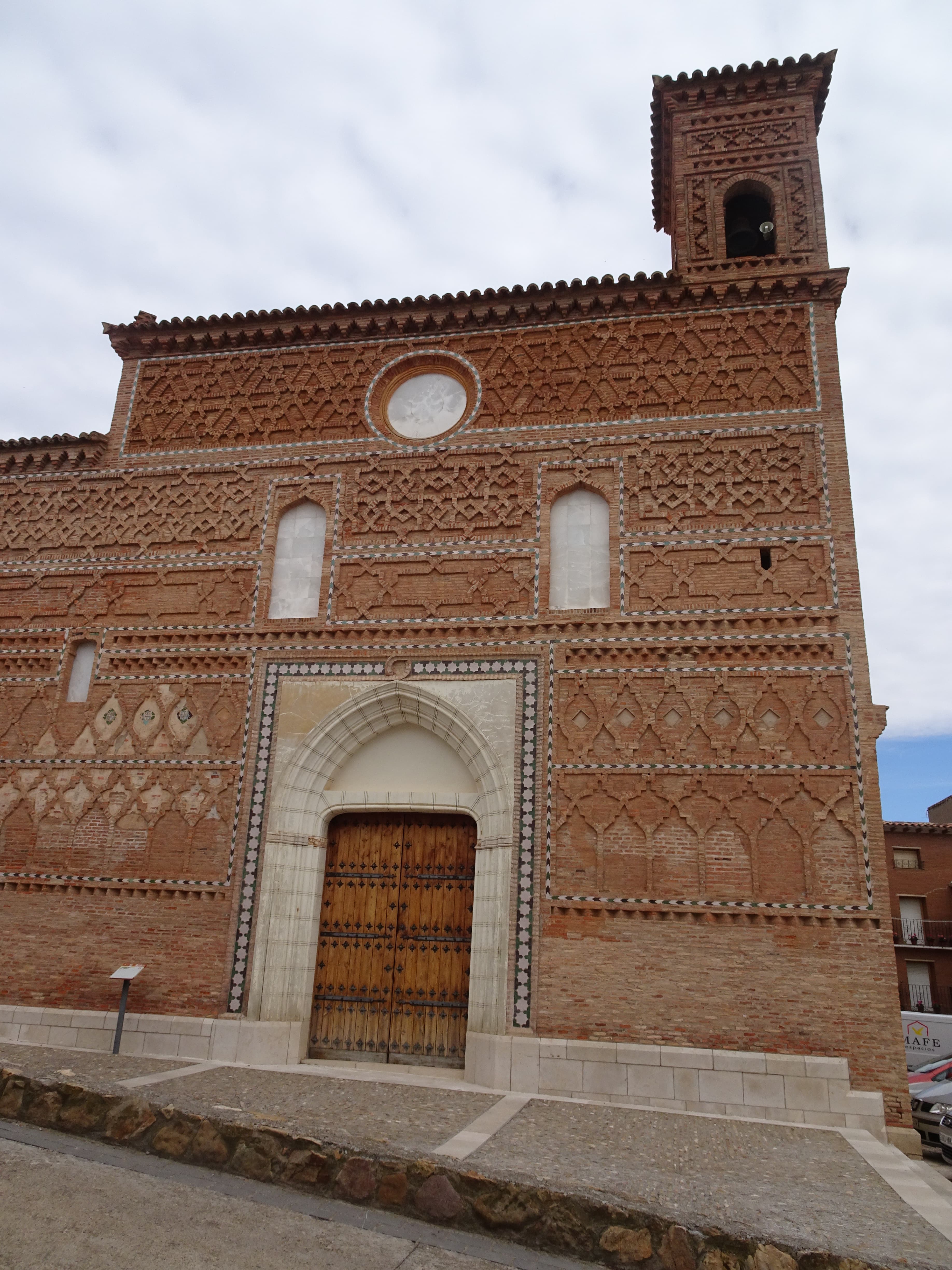Entrance and tower of the Church of Santa María in Tobed, Spain.
